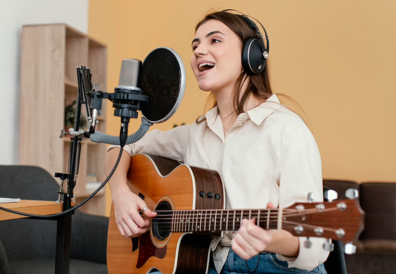 singing person playing guitar